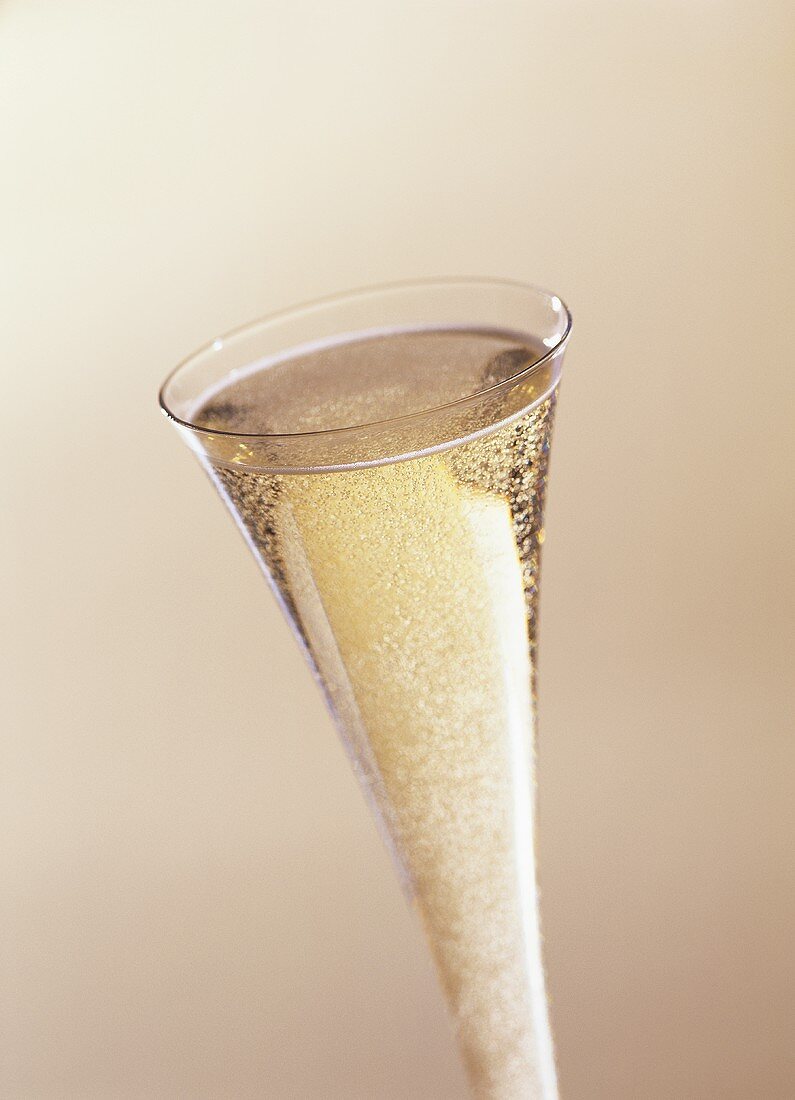 Sparkling wine effervescing in a champagne flute