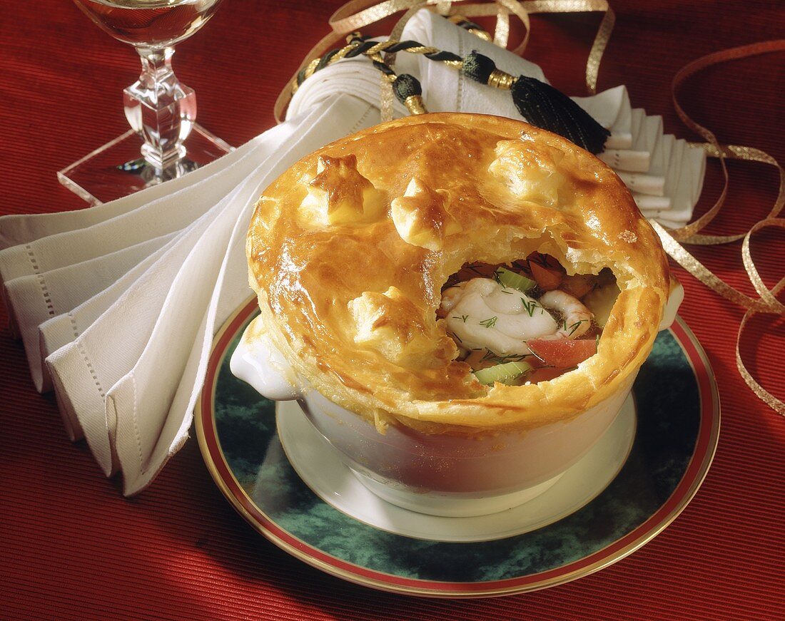 Fish stew under puff pastry topping for Christmas