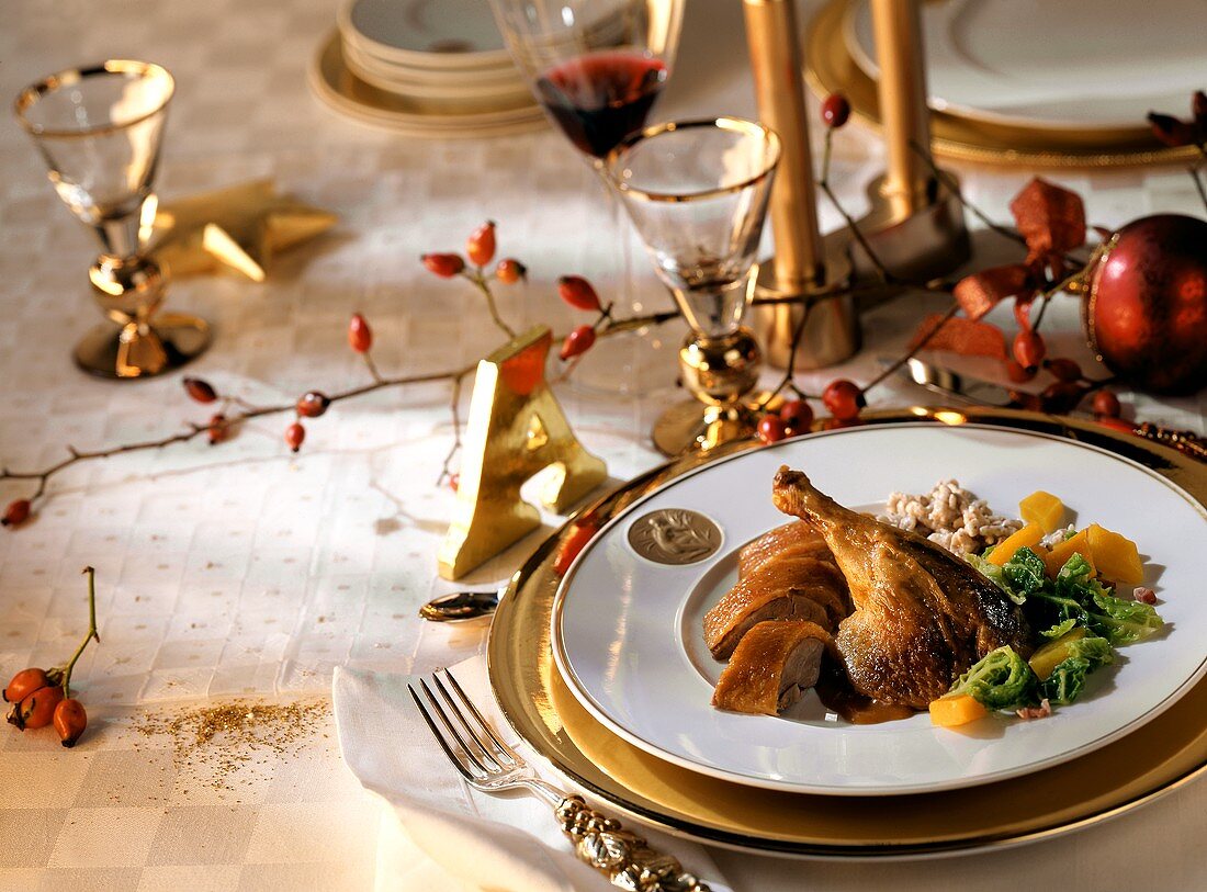 Duck with savoy and nut balls on Christmas table