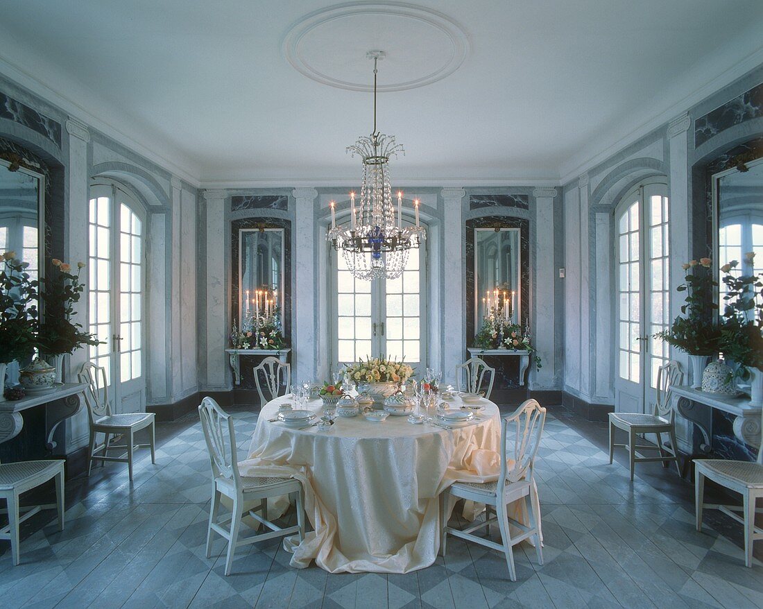 Elegantly laid table in a marble hall