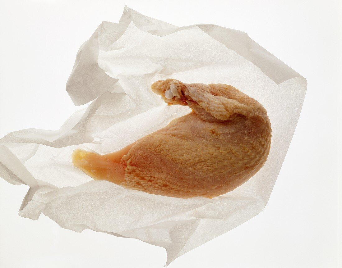Chicken breast on white paper