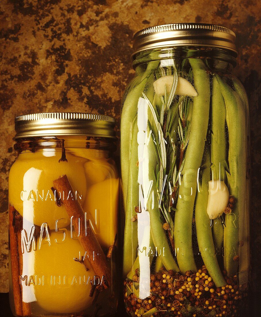 Bottled peaches and spicy green beans in jars