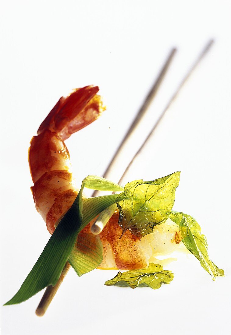 Shrimp between chopsticks