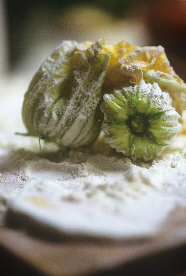 Courgette flowers, tossed in flour