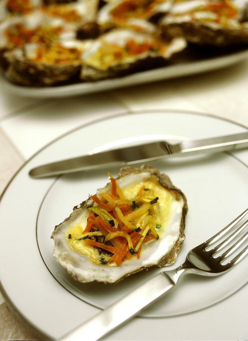 Oysters with julienne vegetables and champagne sauce