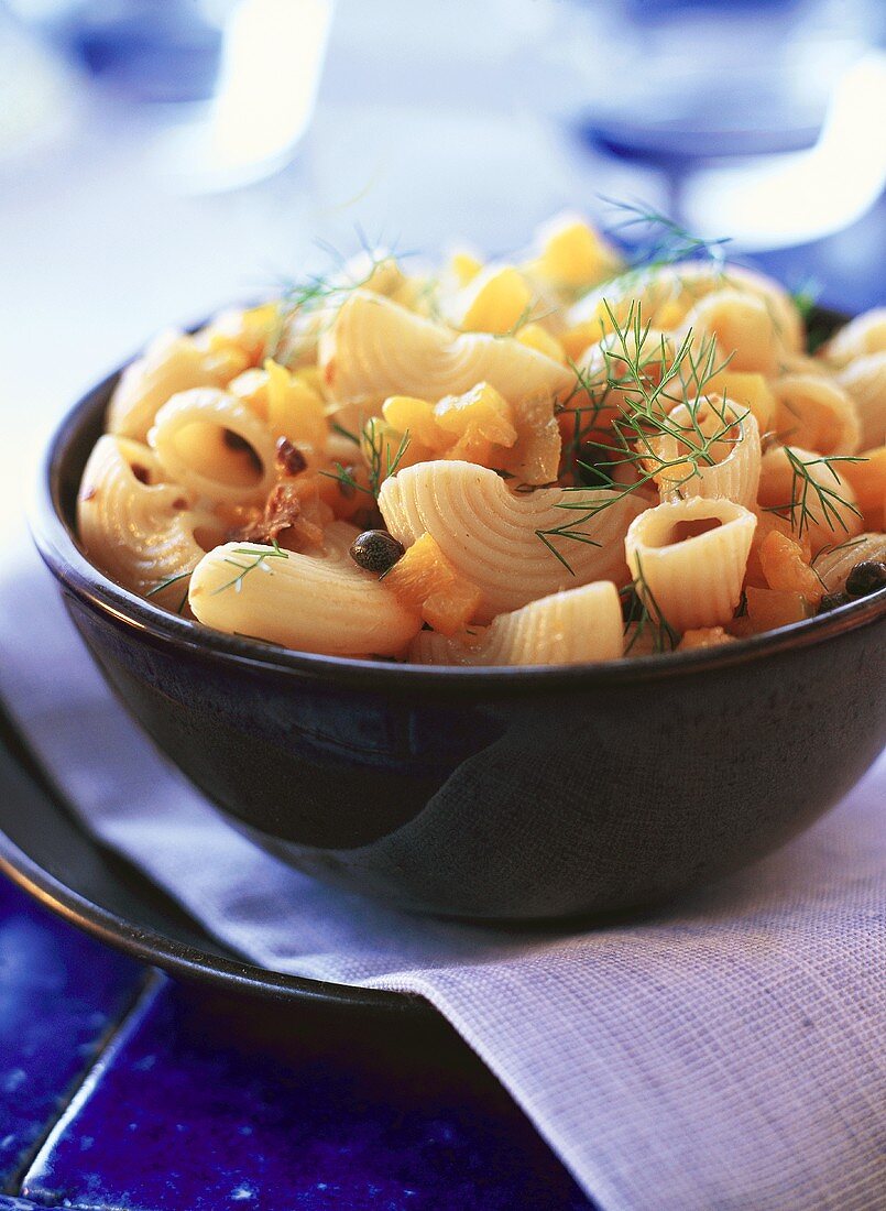 Pasta salad with yellow peppers, capers and dill