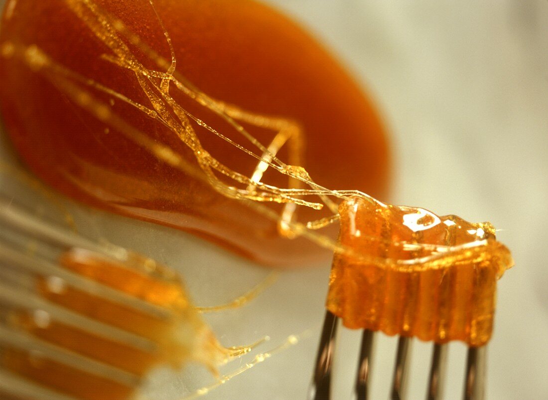 Caramelised sugar, partly on fork