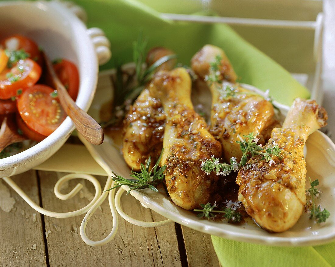 Chicken legs with tomato salad and fresh herbs