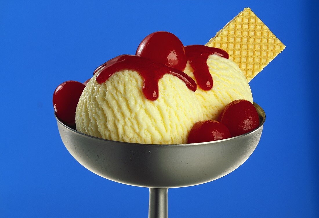 Vanilla ice cream with cherries and cherry sauce
