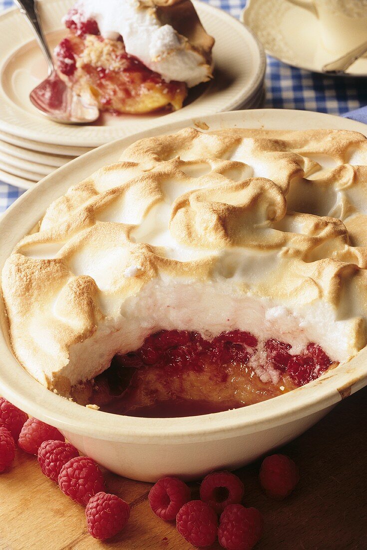 Raspberry pudding with meringue topping in baking dish