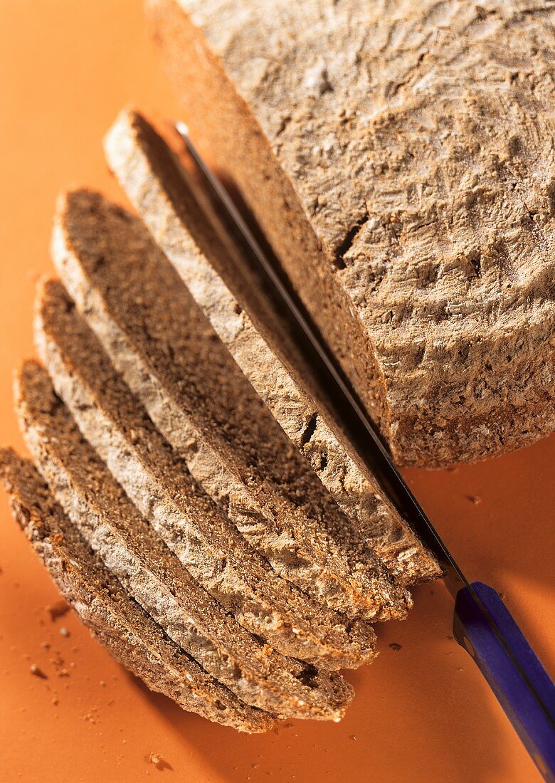 Sourdough rye bread with slices of bread and knife