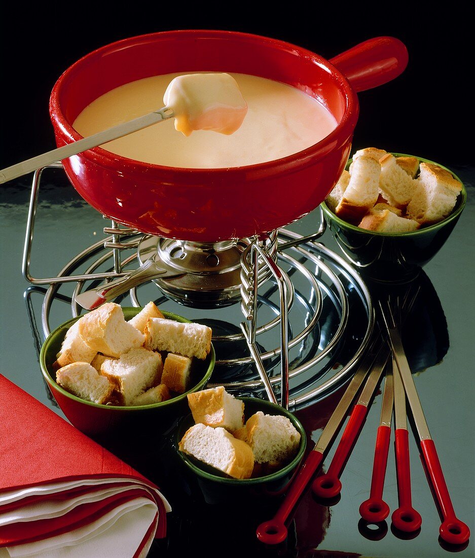 Swiss cheese fondue with white bread cubes