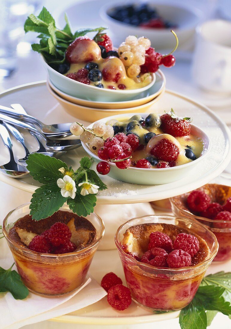 Small raspberry puddings and berries with port zabaione