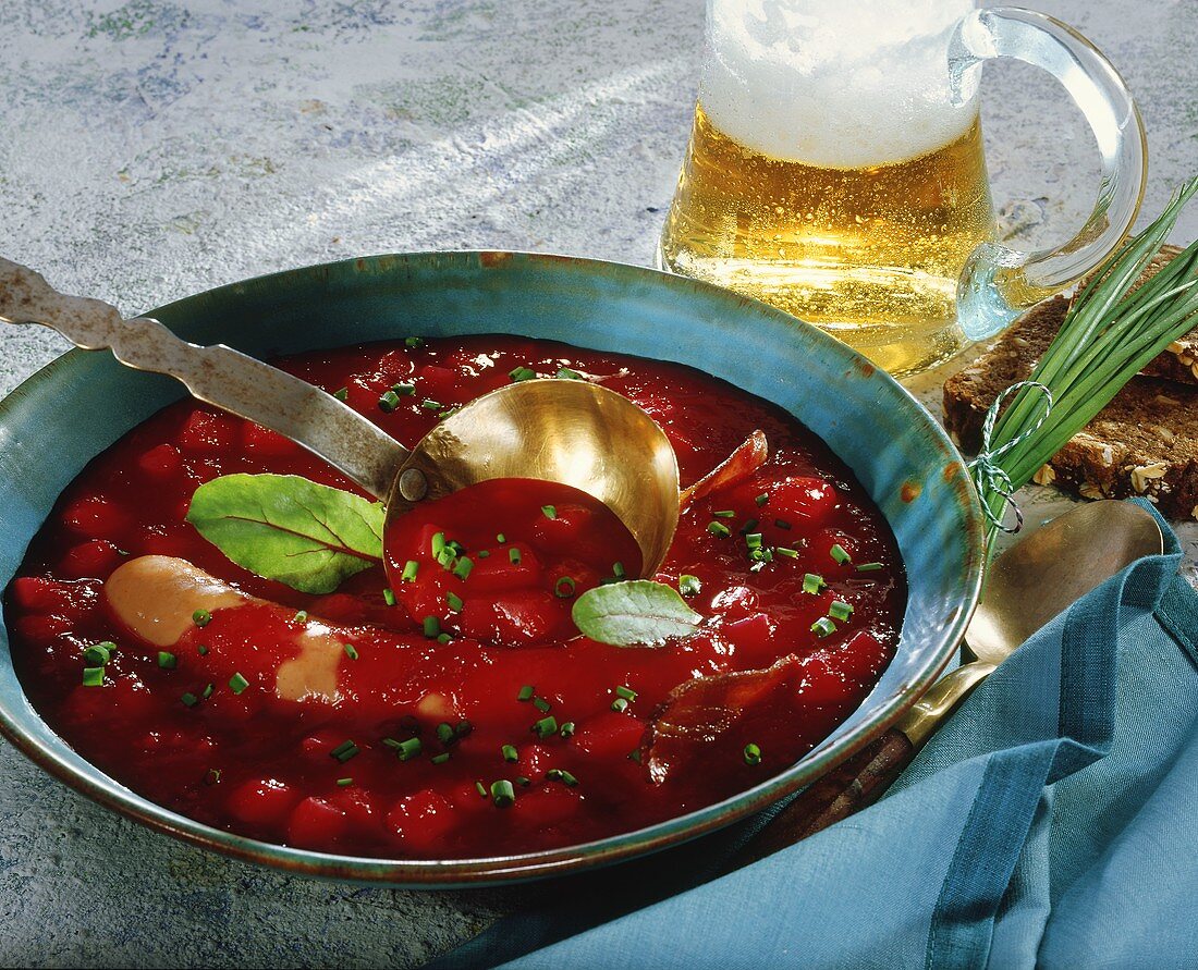 Beetroot soup with Bockwurst (pork sausage) and beer