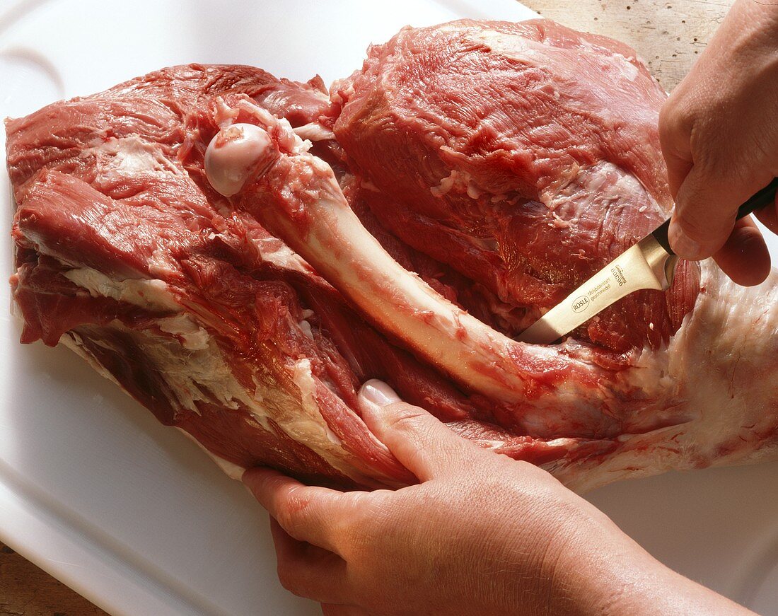 Removing the bones from meat