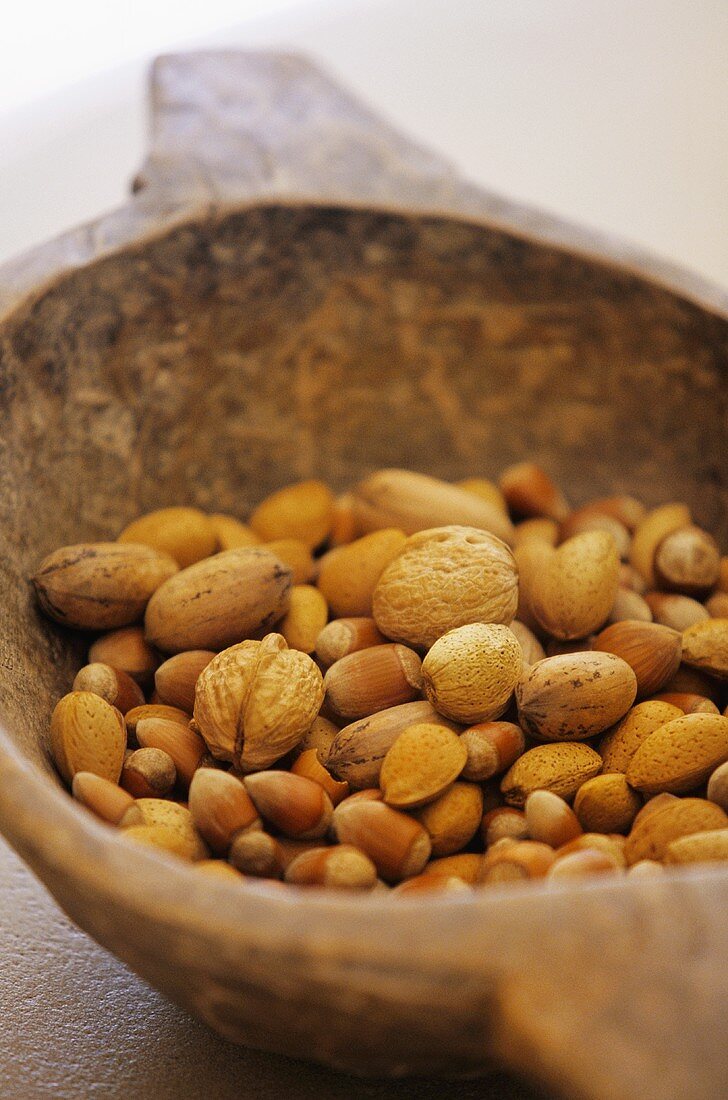 Various nuts in brown bowl