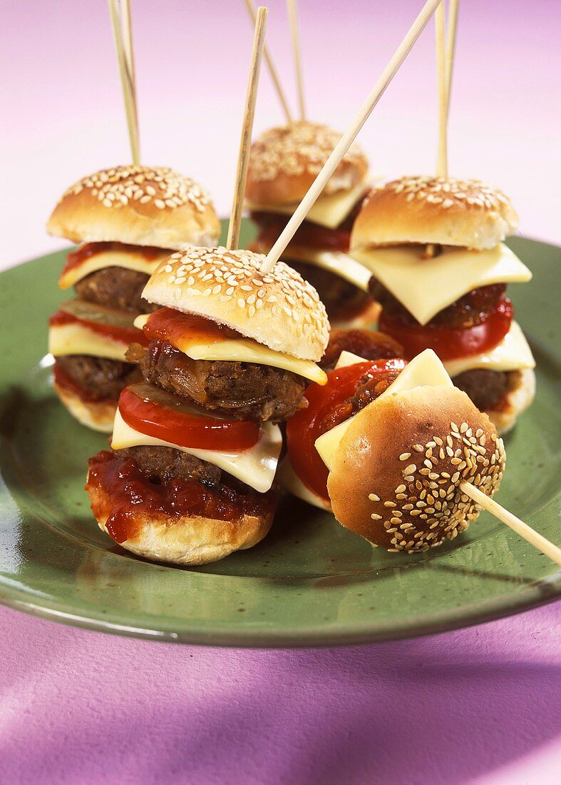 Mini-cheeseburger on wooden cocktail stick