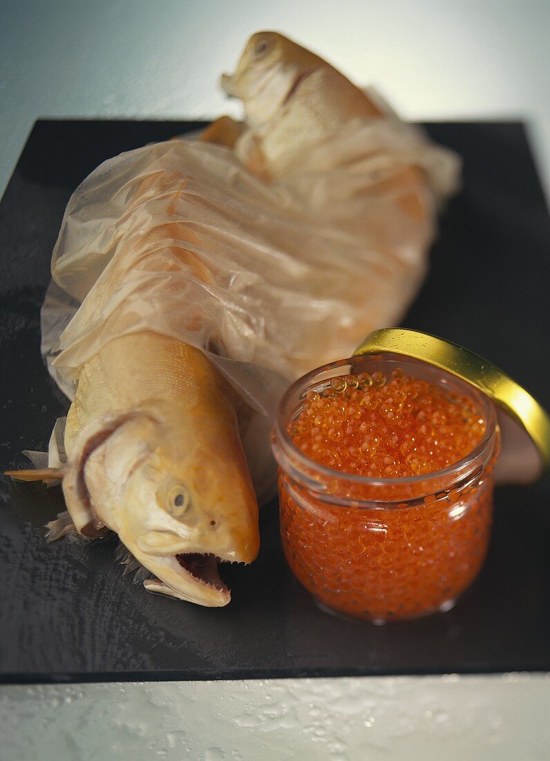 Fresh brown trout and a jar of trout caviare