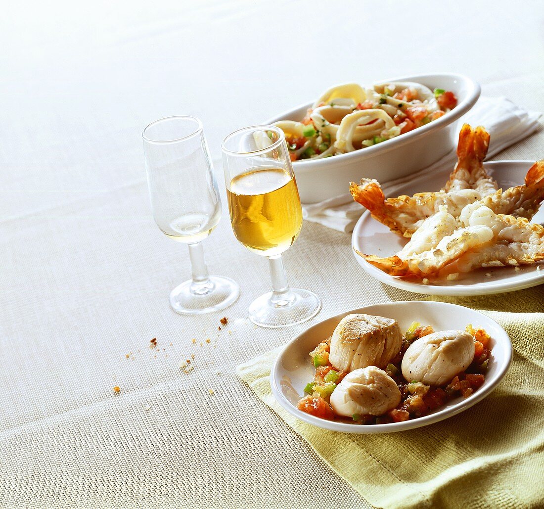 Scallops with salsa; langostinos; cuttlefish salad