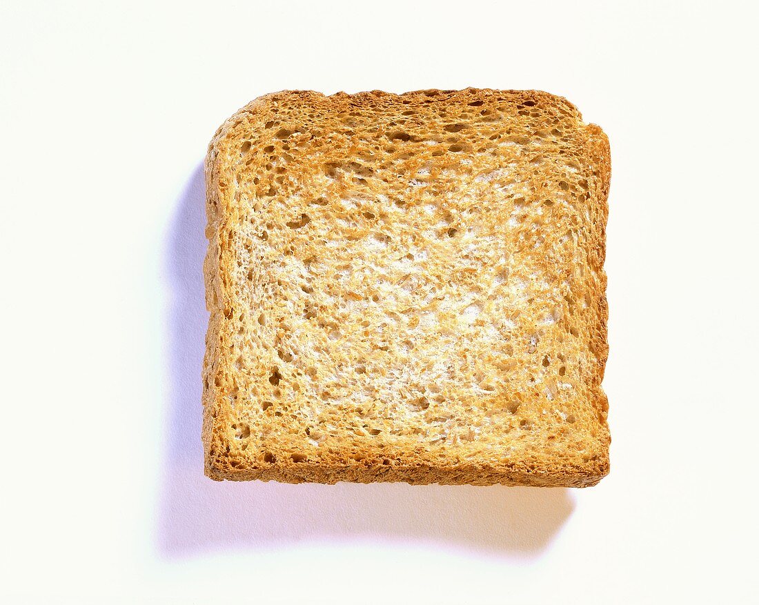 A slice of wholemeal toast on white background