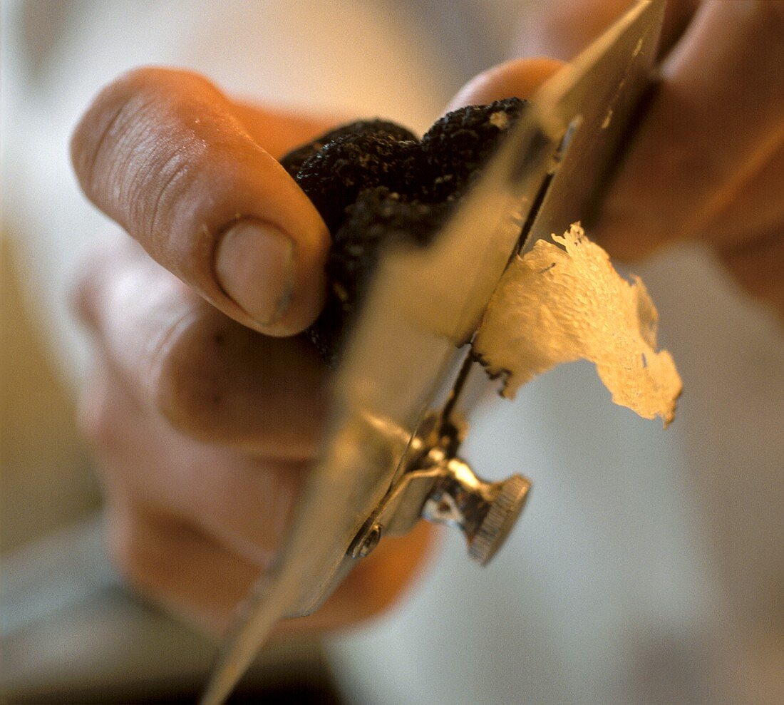 Truffle Being Cut with a Plane