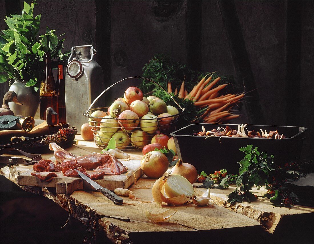 Still life with game, onions, carrots & apples