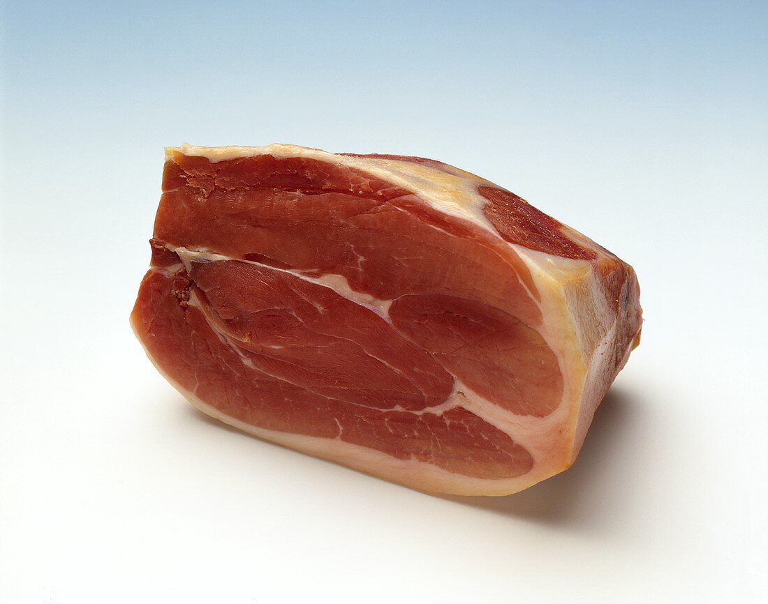 Raw ham on light background