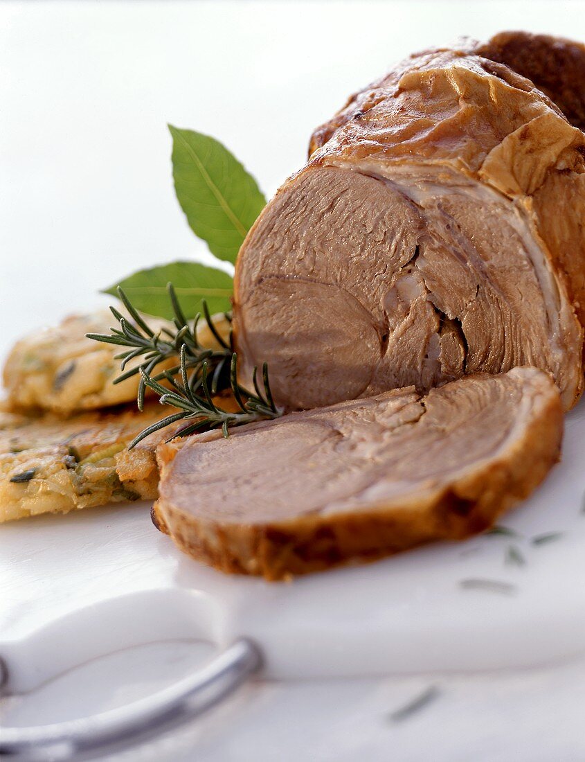 Roast lamb with potato pancakes and fresh herbs