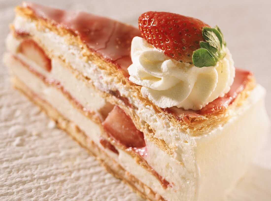 A piece of puff pastry gateau with yoghurt & strawberry filling