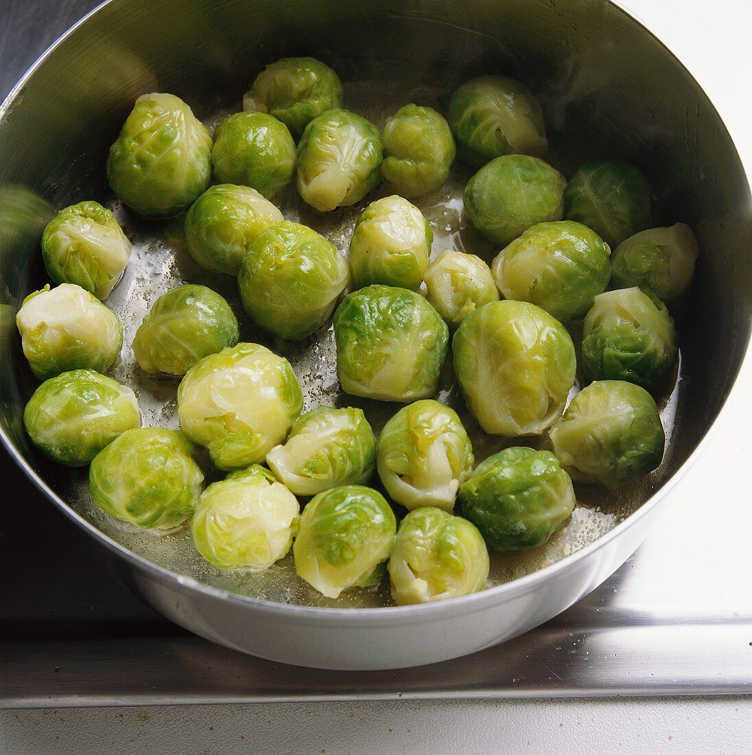 Tossing Brussels sprouts in butter