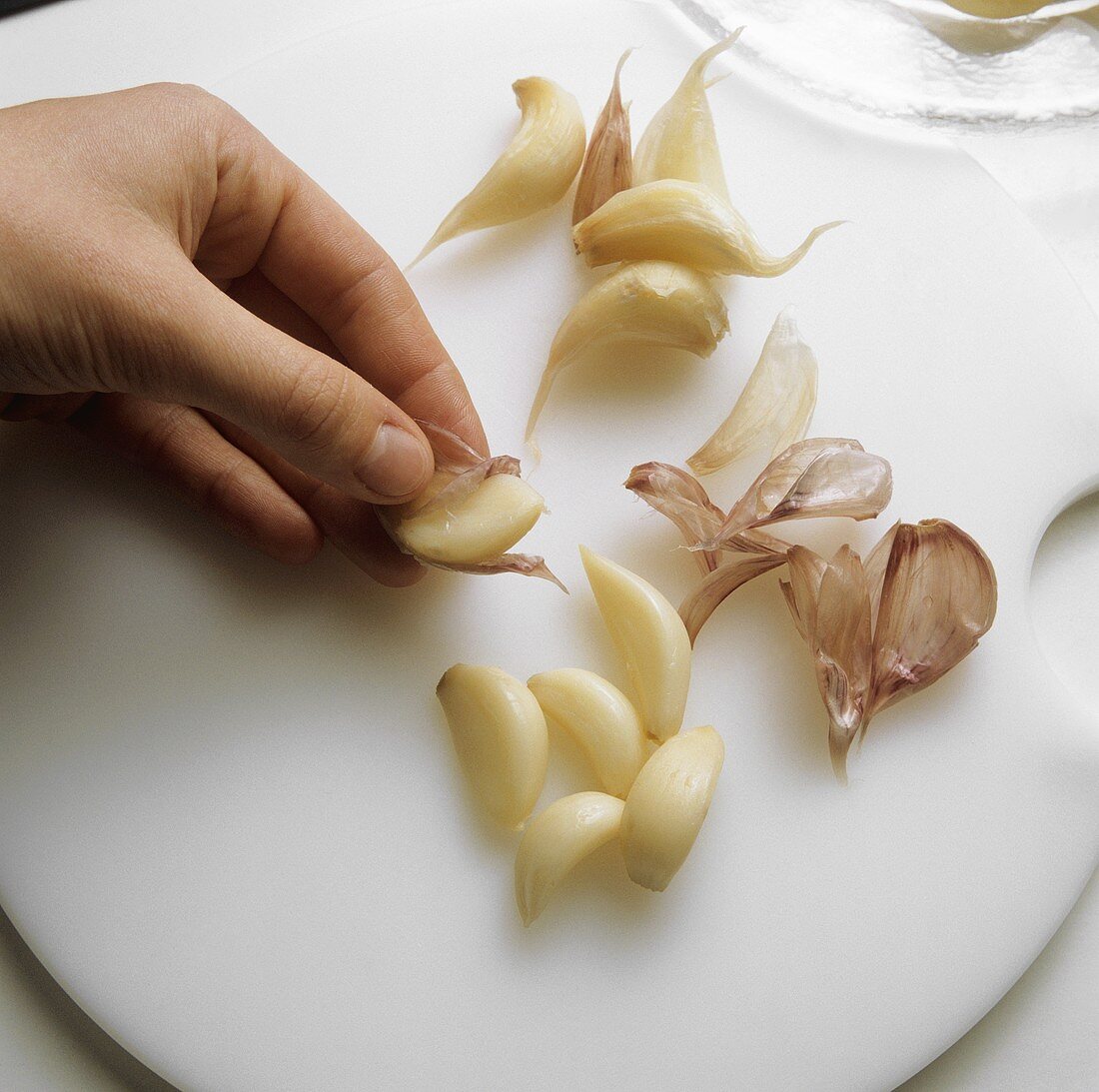Peeling cloves of garlic