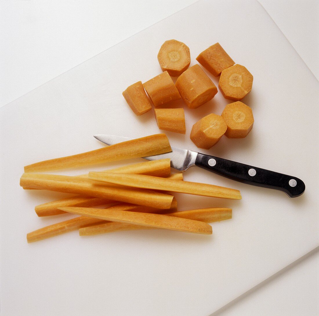 Cutting carrots into chunks and sticks