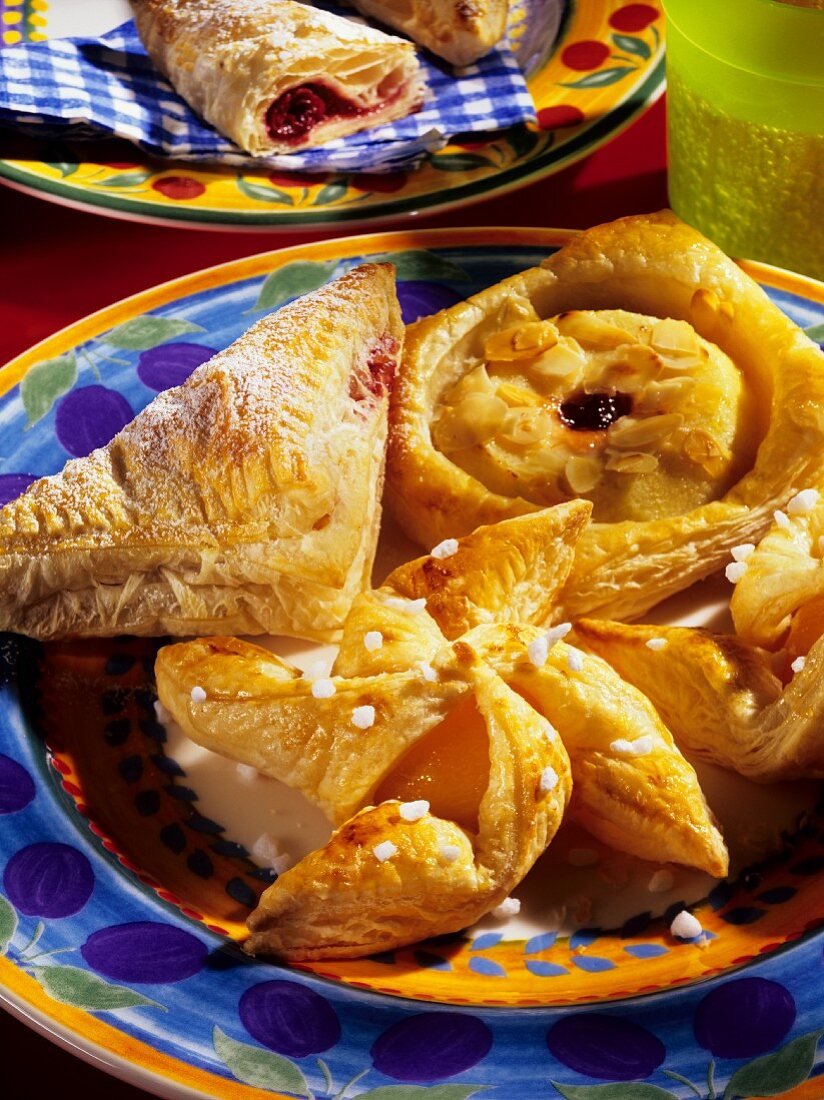Danish pastries: filled puff pastries on colourful plate