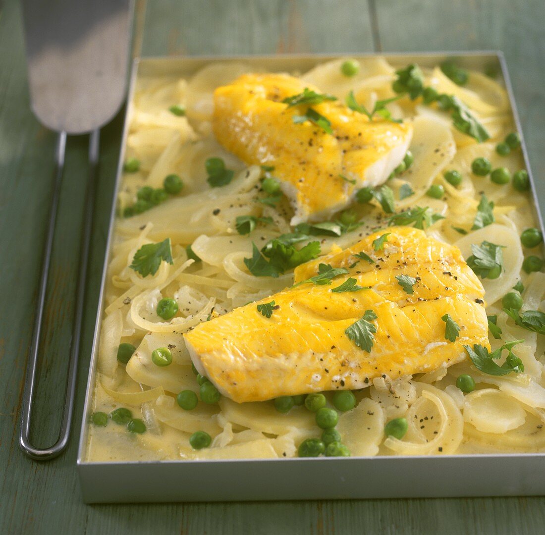 Smoked haddock on onions with peas