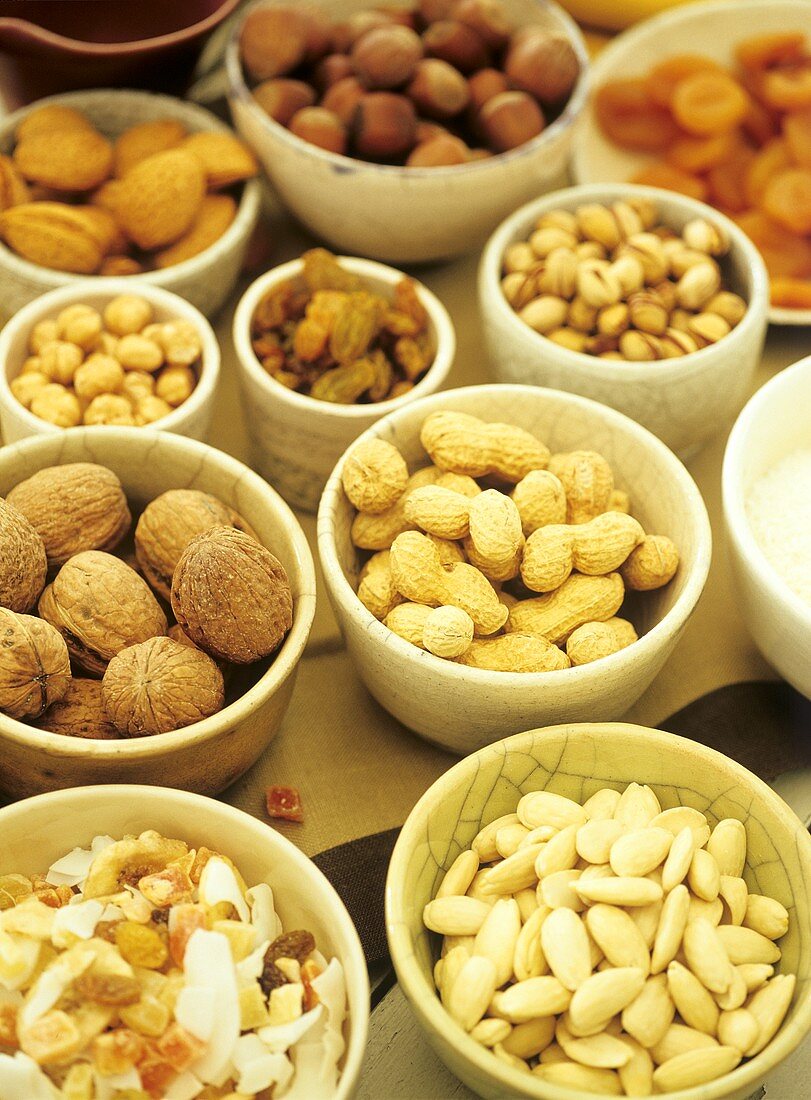 Various nuts and dried fruits in bowls