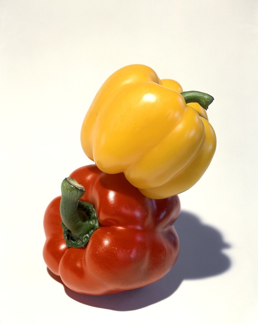Yellow pepper on a red pepper