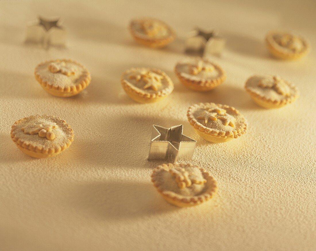 Mince pies with icing sugar and cutters
