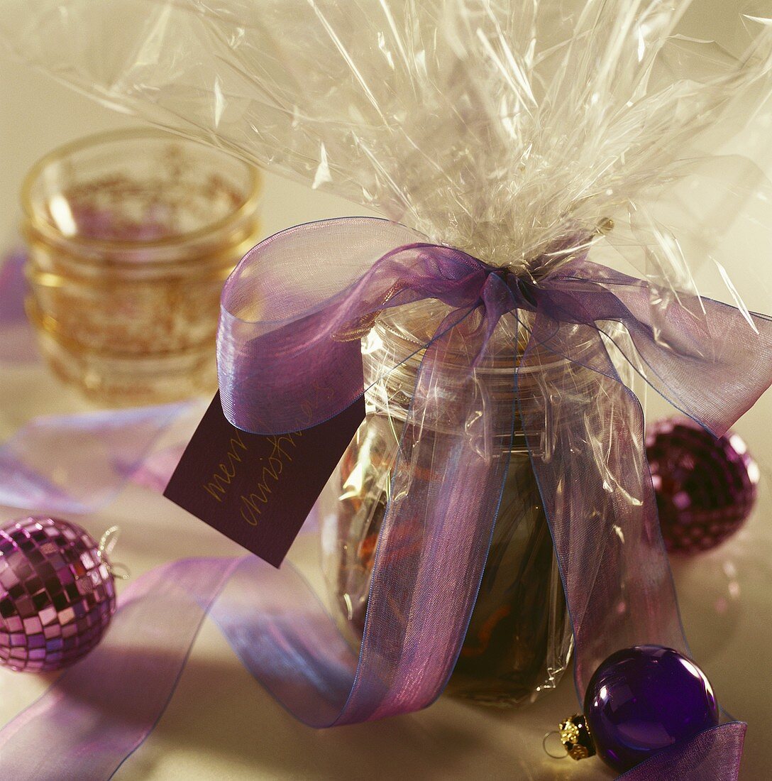 Preserving jar in Christmas wrapping as a gift