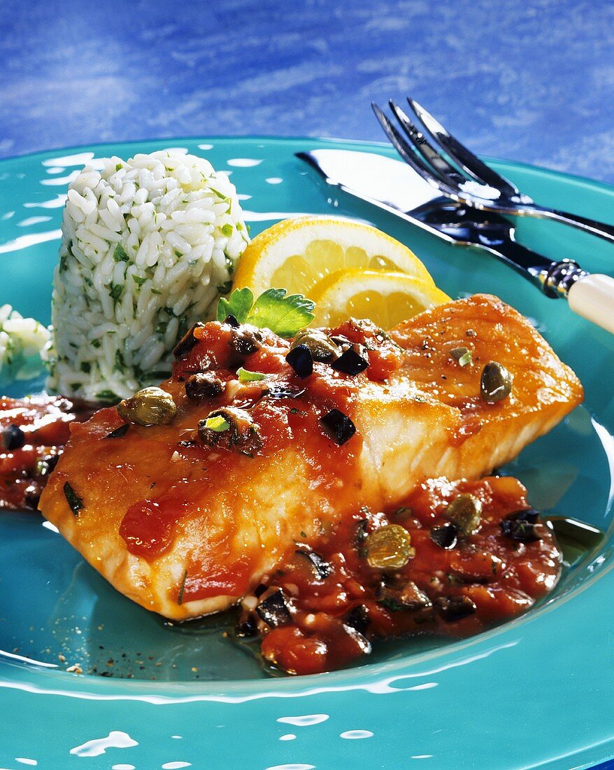 Salmon fillet with tomatoes, olives and rice
