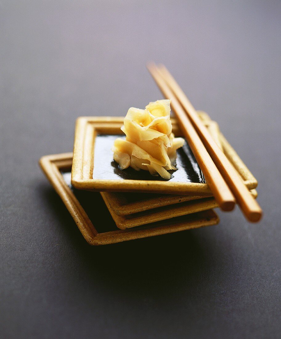 Bottled ginger in bowl with chopsticks
