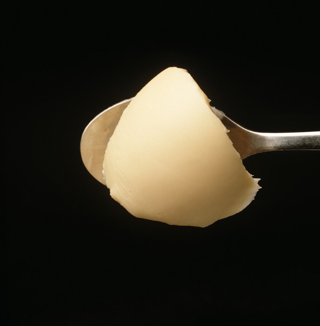 Margarine auf einem Löffel