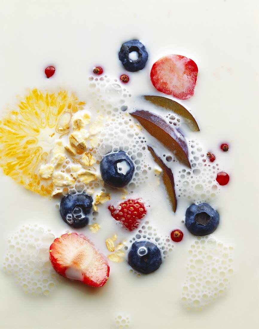 Muesli with fruit, berries, milk and rolled oats