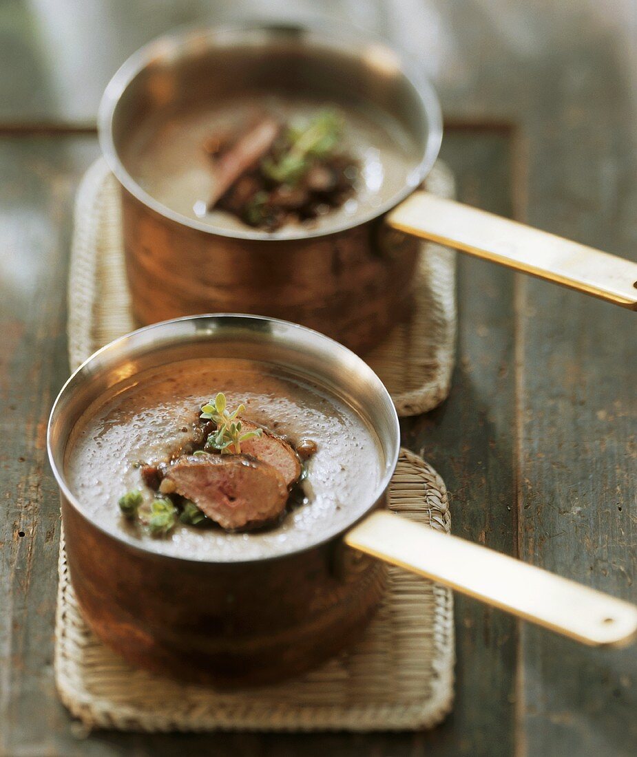 Lentil soup with fried rabbit liver in copper pans