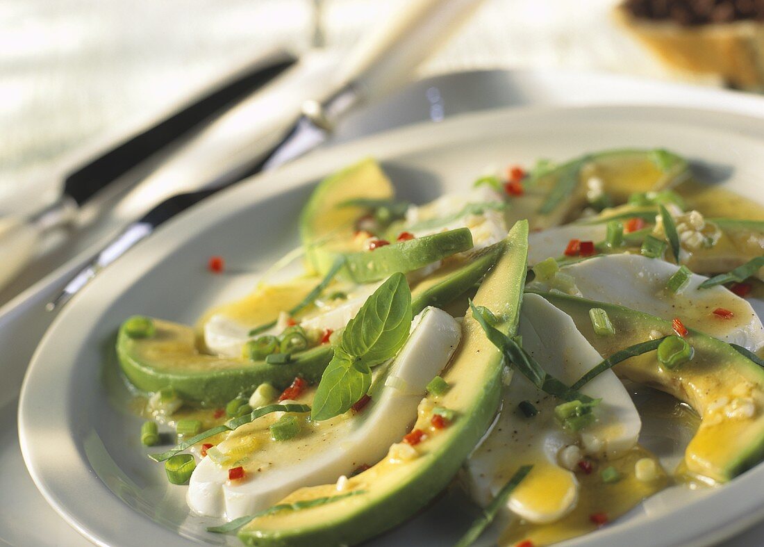 Mozzarella salad with avocados and basil