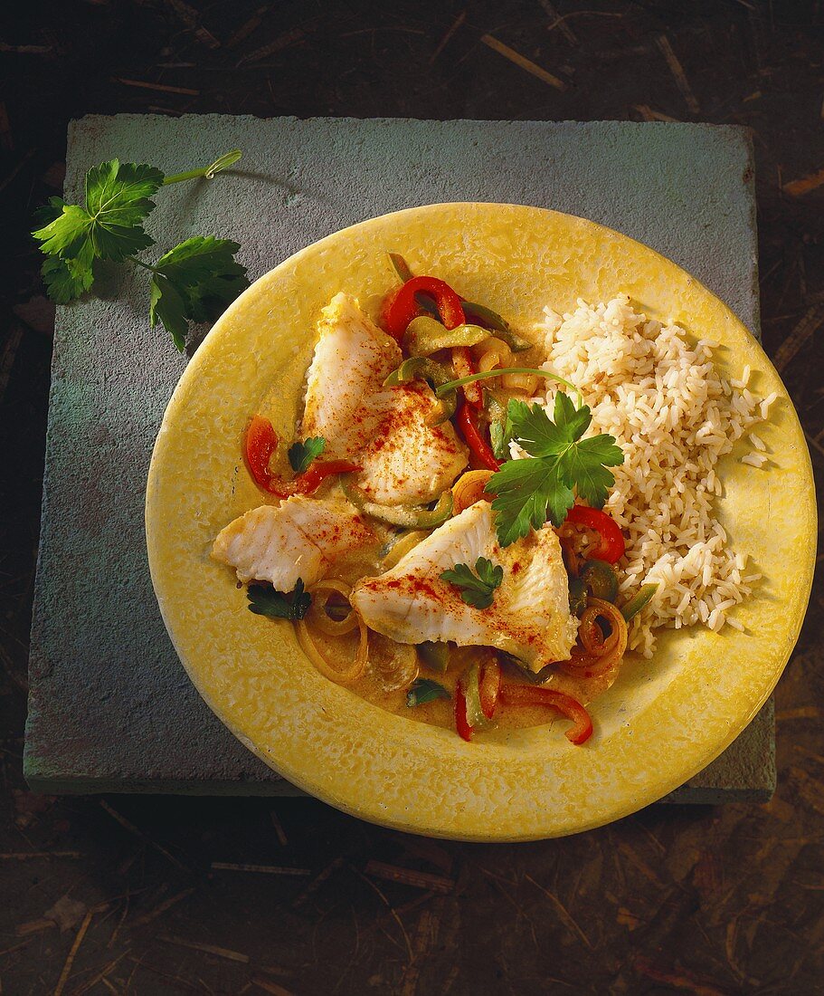 Hungarian fish ragout with peppers, onions and rice