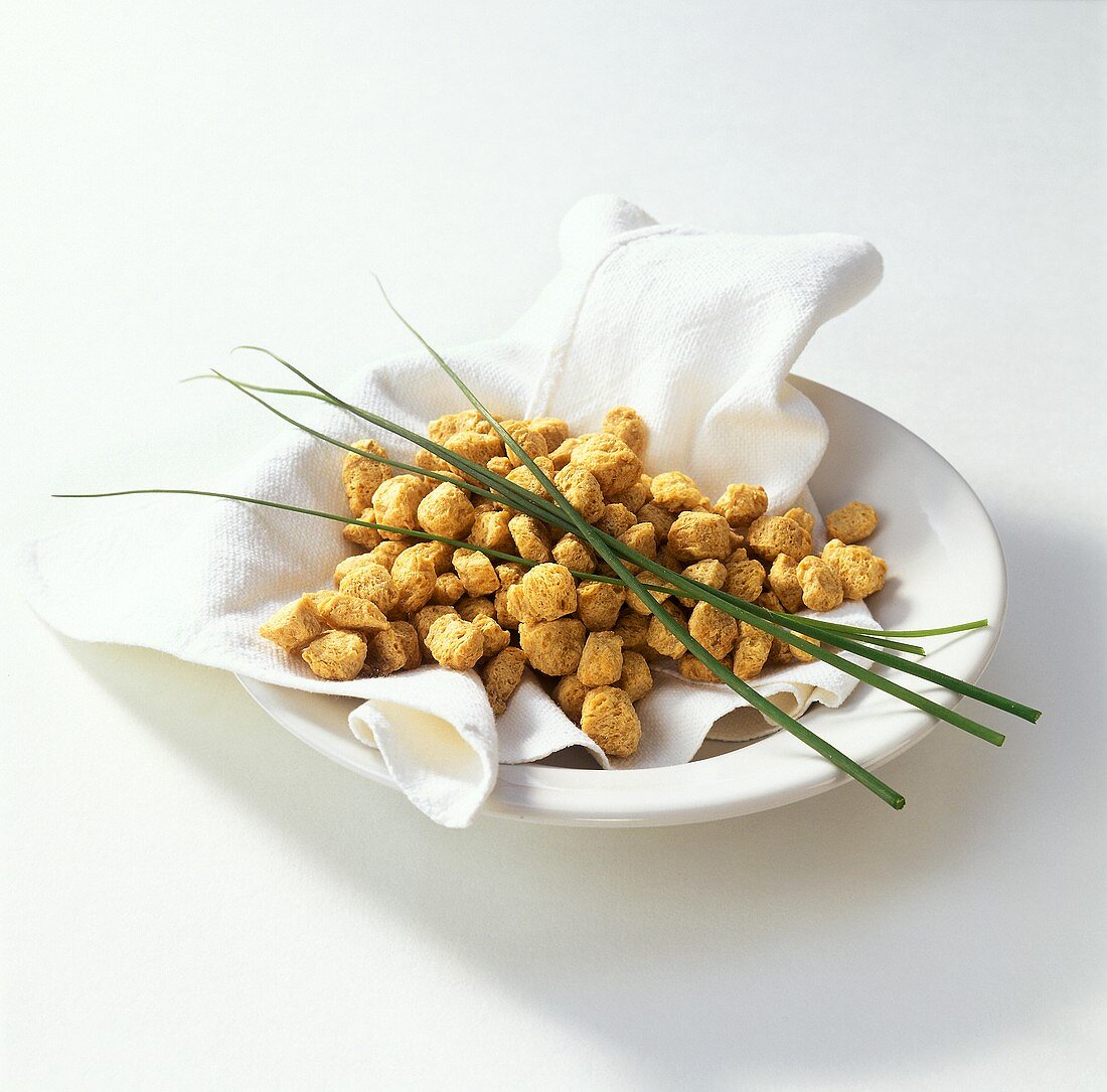 Vega-Vita cube with chives on plate