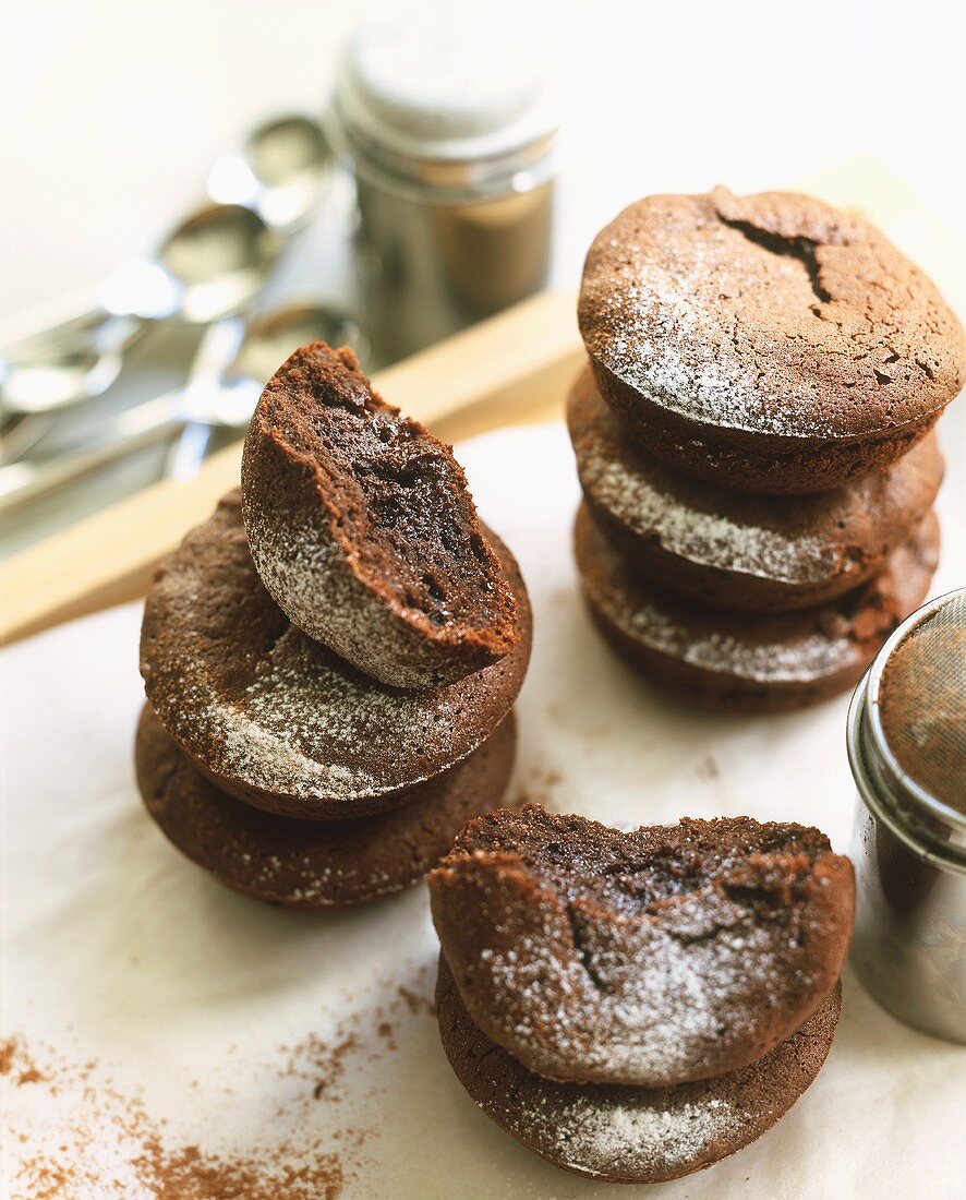 Chocolate buns with icing sugar in two piles