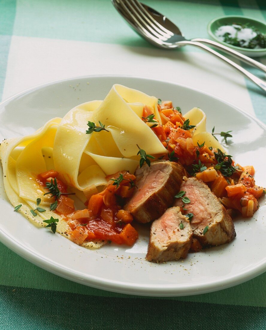 Pork fillet with pappardelle and diced tomatoes