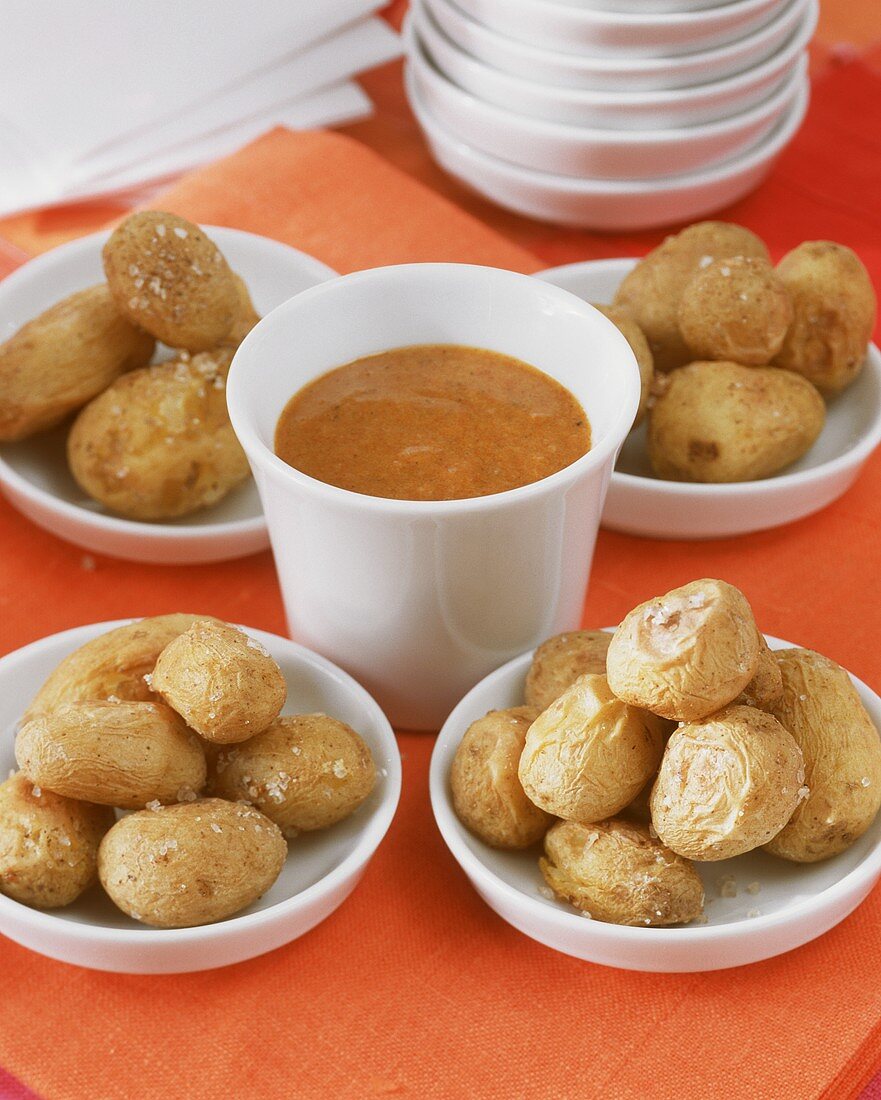 Potatoes with spicy sauce on a buffet table