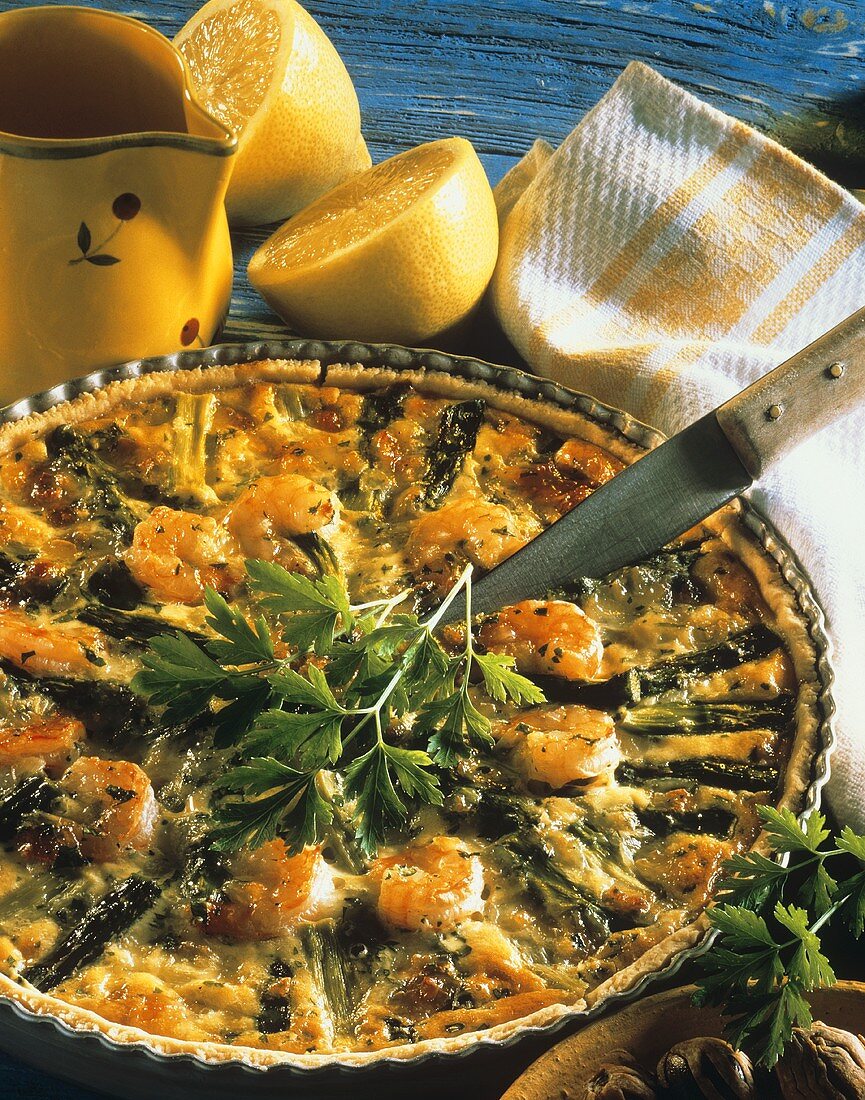 Asparagus quiche with shrimps in baking dish